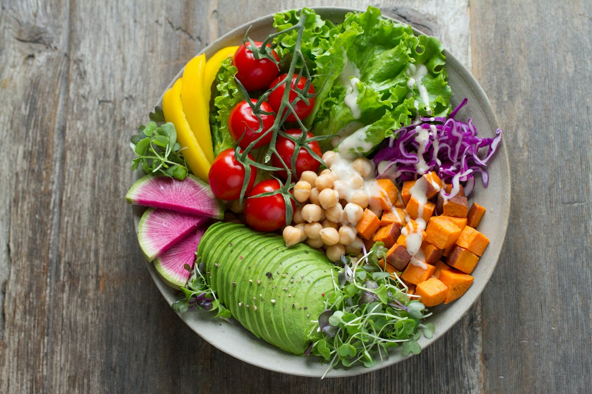 A fresh green salad with leafy greens in a bowl